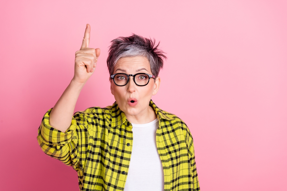 Jane, a bookkeeper, is seen raising her pointer finger and she looks like she's shouting. Previously to using Gatheroo, Jane was forever chasing clients for their information and felt like she was always nagging them.